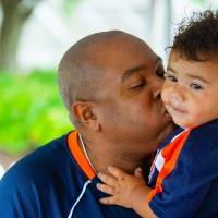 Man holding boy at Comerica Park event